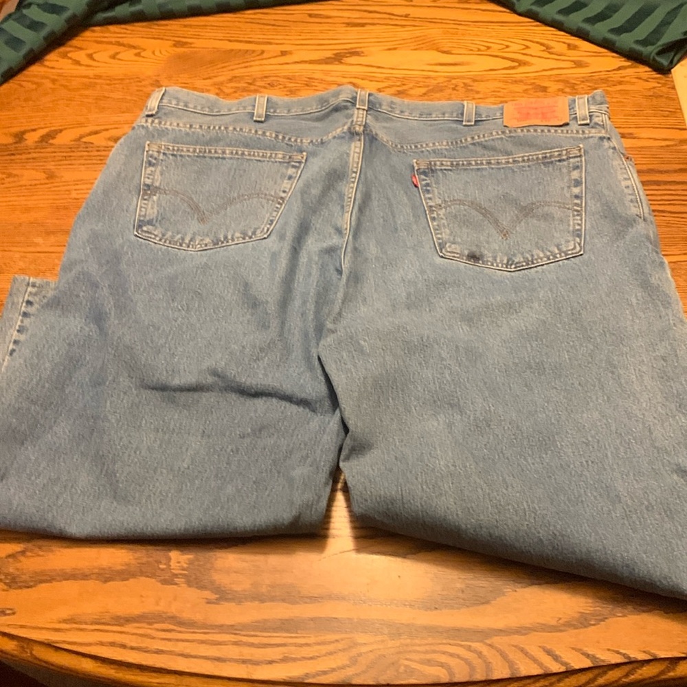 Used Levi 560 blue jeans altered 46x 24
